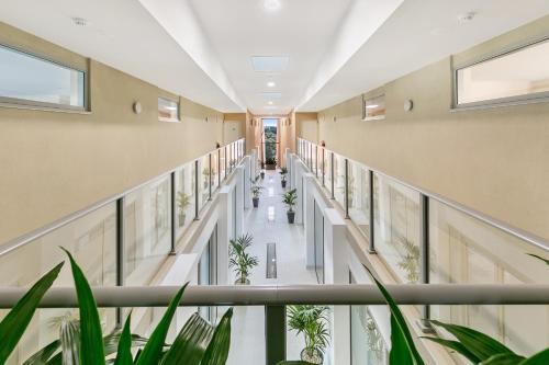 an image of a hospital hallway with plants at Salt 15 Luxury Apartment in Sorrento