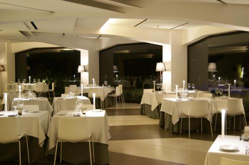 a large dining room with tables and chairs at Eolian Milazzo Hotel in Milazzo