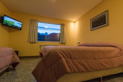 Uma cama ou camas num quarto em Apart Guillaumet