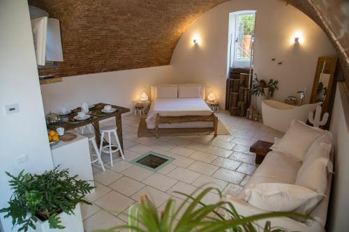 a living room with a couch and a table at La Torre Medioevale in Marne di Filago