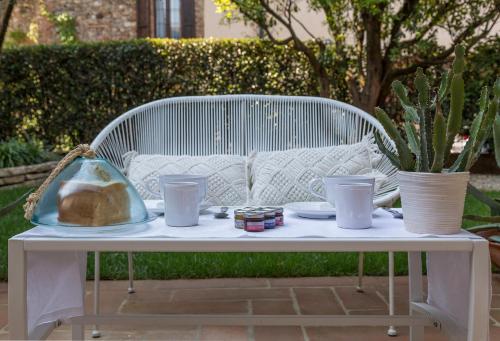 a white table with food and drinks on it at La Torre Medioevale in Marne di Filago