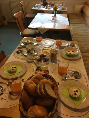 a table with plates of food on top of it at Haus Müller in Reutte