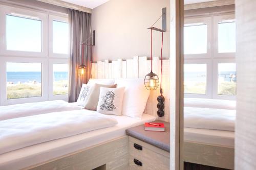 Letto o letti in una camera di Bretterbude Heiligenhafen
