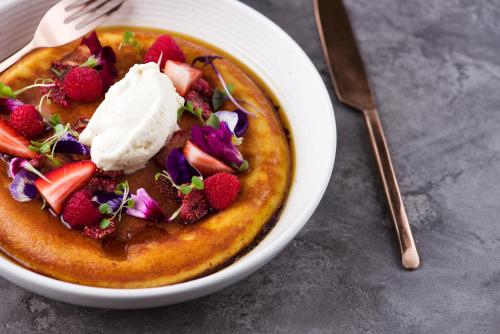 a bowl of food with strawberries and ice cream at Treasury Brisbane in Brisbane