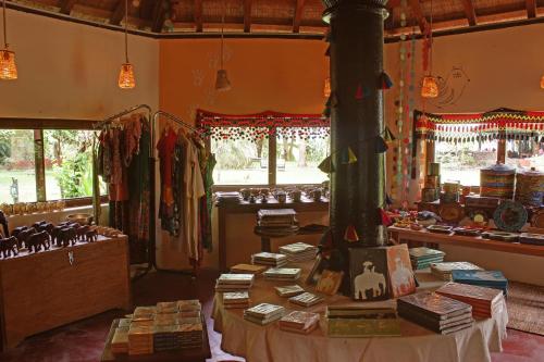 a store with a table with books on it at Sapana Village Lodge in Sauraha