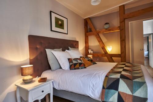 Säng eller sängar i ett rum på Les Appartements Saint-Martin