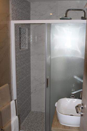 a bathroom with a shower and a sink at Apartments Sunset in Hvar