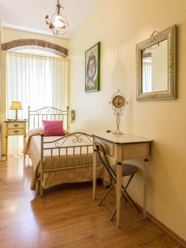 Кровать или кровати в номере Hotel Lieto Soggiorno