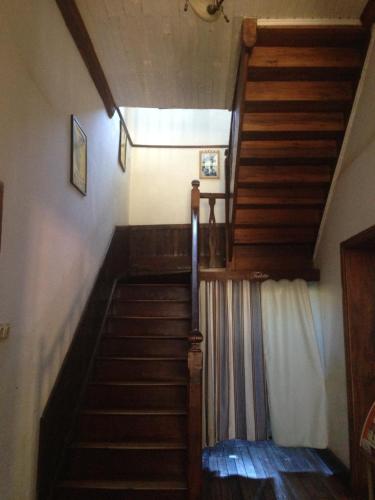 a stairway in a house with wooden stairs at Hotel le Trianon in Antsirabe