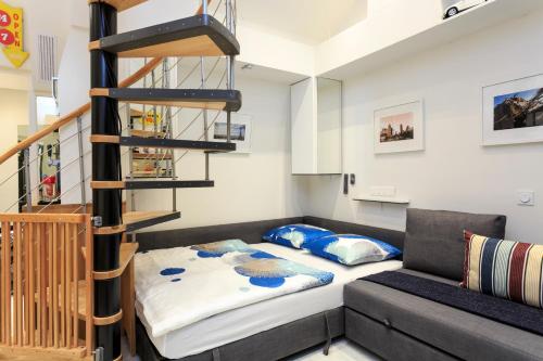 a small room with a bed and a couch at Louvre Luxury Apartment & SPA in Paris