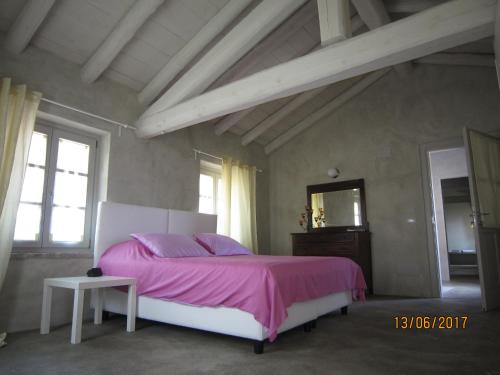 Postel nebo postele na pokoji v ubytování Casa Torre Allera