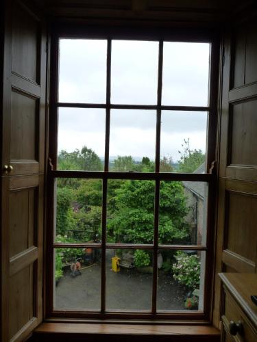 an open window with a view of a yard at Stirabout Lane B&B in Rathdrum