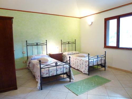Postel nebo postele na pokoji v ubytování B&B Su Frascu Segau