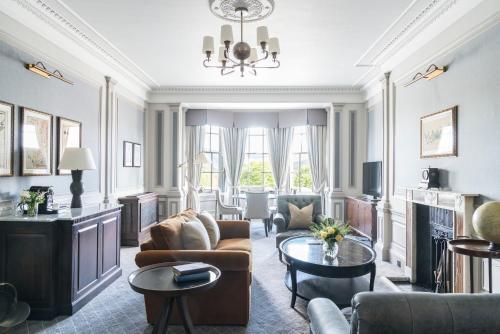 a living room with a couch and a table at The Gleneagles Hotel in Auchterarder