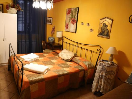 a bedroom with a bed in a room at Kimera in Piazza Armerina