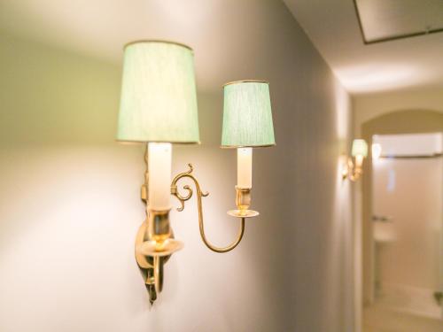 a pair of lights on a wall in a room at The Sunny Suite - R.Q.C. in The Hague