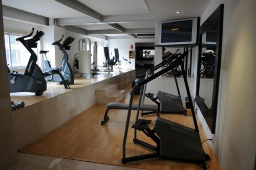 a gym with treadmills and elliptical machines at Hotel Palacio Azteca Tijuana, Trademark by Wyndham in Tijuana