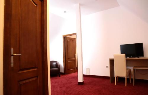 TV a/nebo společenská místnost v ubytování Hotel Apollonia