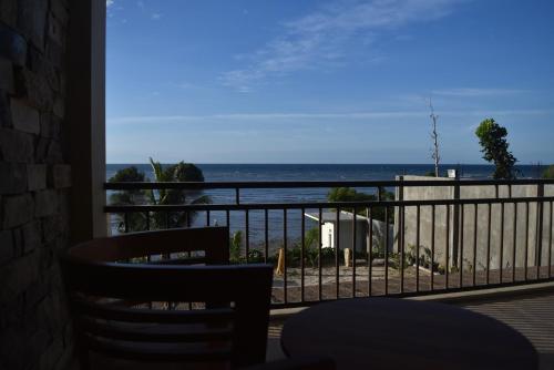 a balcony with a view of the ocean at Padadita Beach Hotel in Waingapu