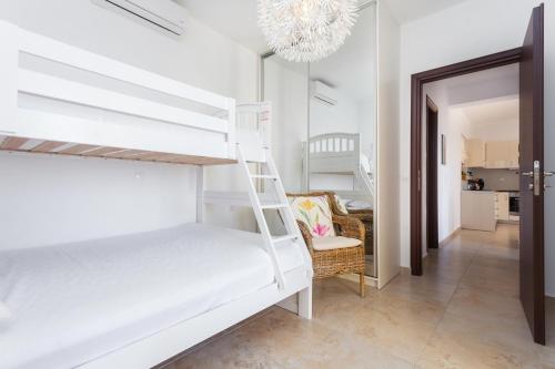 A bed or beds in a room at Wormwood - Morfi Village