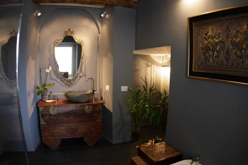 a bathroom with a sink and a mirror on the wall at Casa Galante in Cividale del Friuli