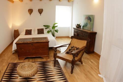 En eller flere senge i et værelse på Casa Galante