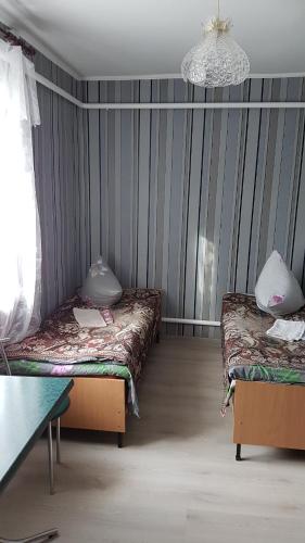 Katil atau katil-katil dalam bilik di Glamour Hotel