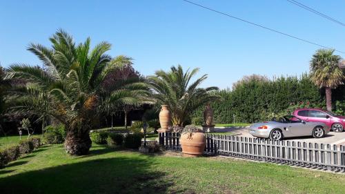 a car parked in a parking lot next to a fence at B&B Villa Roberta in Viterbo