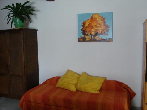 Una cama o camas en una habitación de Gites Le Grand Jardin