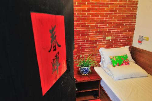 Postel nebo postele na pokoji v ubytování Feng Mao Lin Zhi
