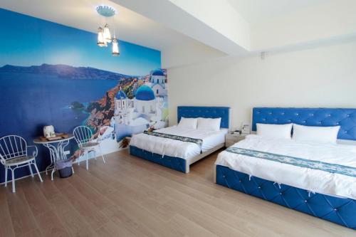 Postel nebo postele na pokoji v ubytování Jin Du Yi Yuan B & B