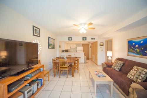 a living room with a couch and a table at South Padre Island Beach Rentals in South Padre Island