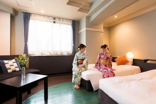 Postel nebo postele na pokoji v ubytování Hotel In Kyoto Sasarindou