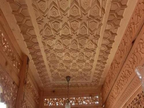 a ceiling of a building with a chandelier hanging from it at Chicago Group of Houseboats in Srinagar