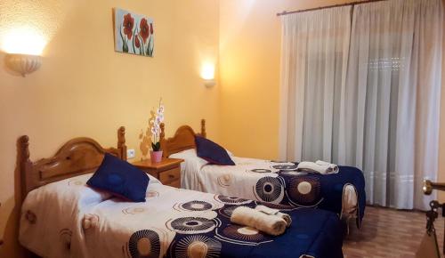 Ένα ή περισσότερα κρεβάτια σε δωμάτιο στο Hostal rural El Caminero