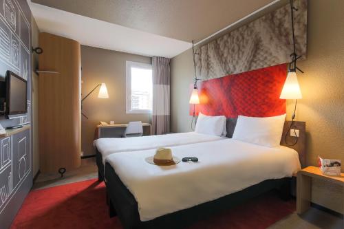 Una cama o camas en una habitación de Ibis Albi