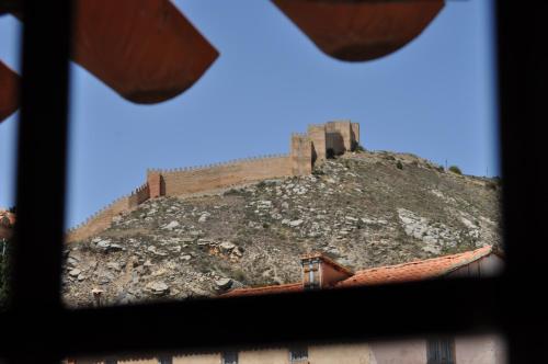 a view of a castle on top of a hill at Hotel la Casa del Abuelo in Albarracín