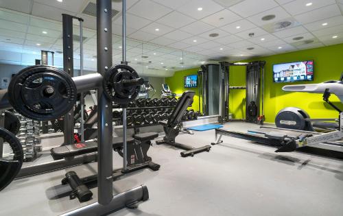 a gym with lots of equipment in a room at Thon Hotel Rosenkrantz Bergen in Bergen