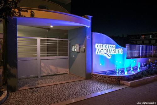 a building with a sign that says escape evacuate at Residence Acquasuite in Martinsicuro