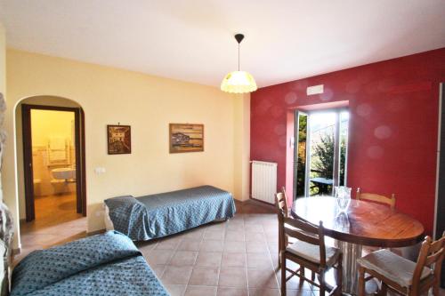 a living room with a table and a dining room at Casarufolo Paradise in Sorrento