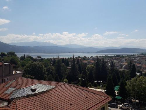 a view of a city with a lake in the background at SAZ City Life Boutique Hotel in Ioannina