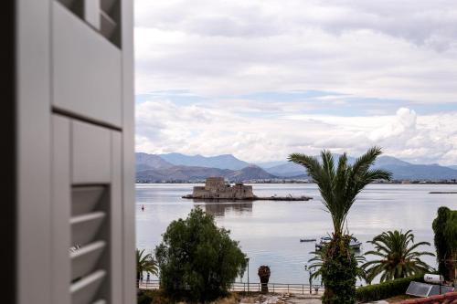 a view of a body of water with a castle in it at Gambello Luxury Rooms in Nafplio