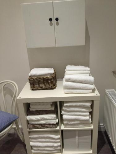 a white towel rack with towels on it at Die schöne Auguste in Oldenburg