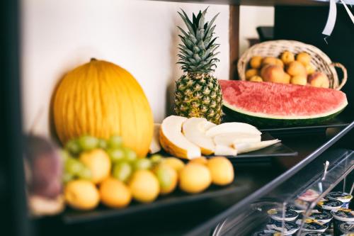 a table with fruits and vegetables on top at Palazzo Lauritano in Agerola
