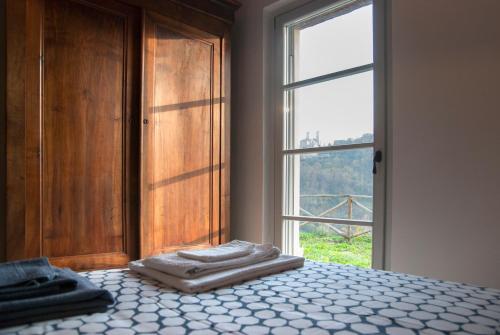 Tempat tidur dalam kamar di Casale Biancopecora