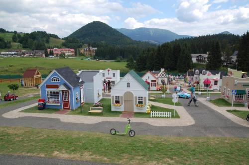 an aerial view of a small town with houses at Apartmán Šafran in Donovaly