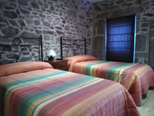 Ένα ή περισσότερα κρεβάτια σε δωμάτιο στο Casa dos Eiriz