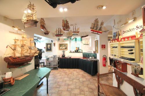 a room with a pirate ship on the wall at Hotel Zu den Linden in Dresden