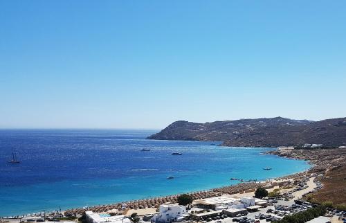 a view of a beach with boats in the water at Mykonian Dianthus in Elia Beach