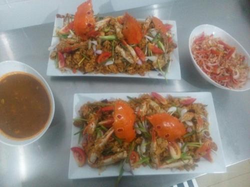 a table with three plates of food and a bowl of soup at Handun Villas in Talalla